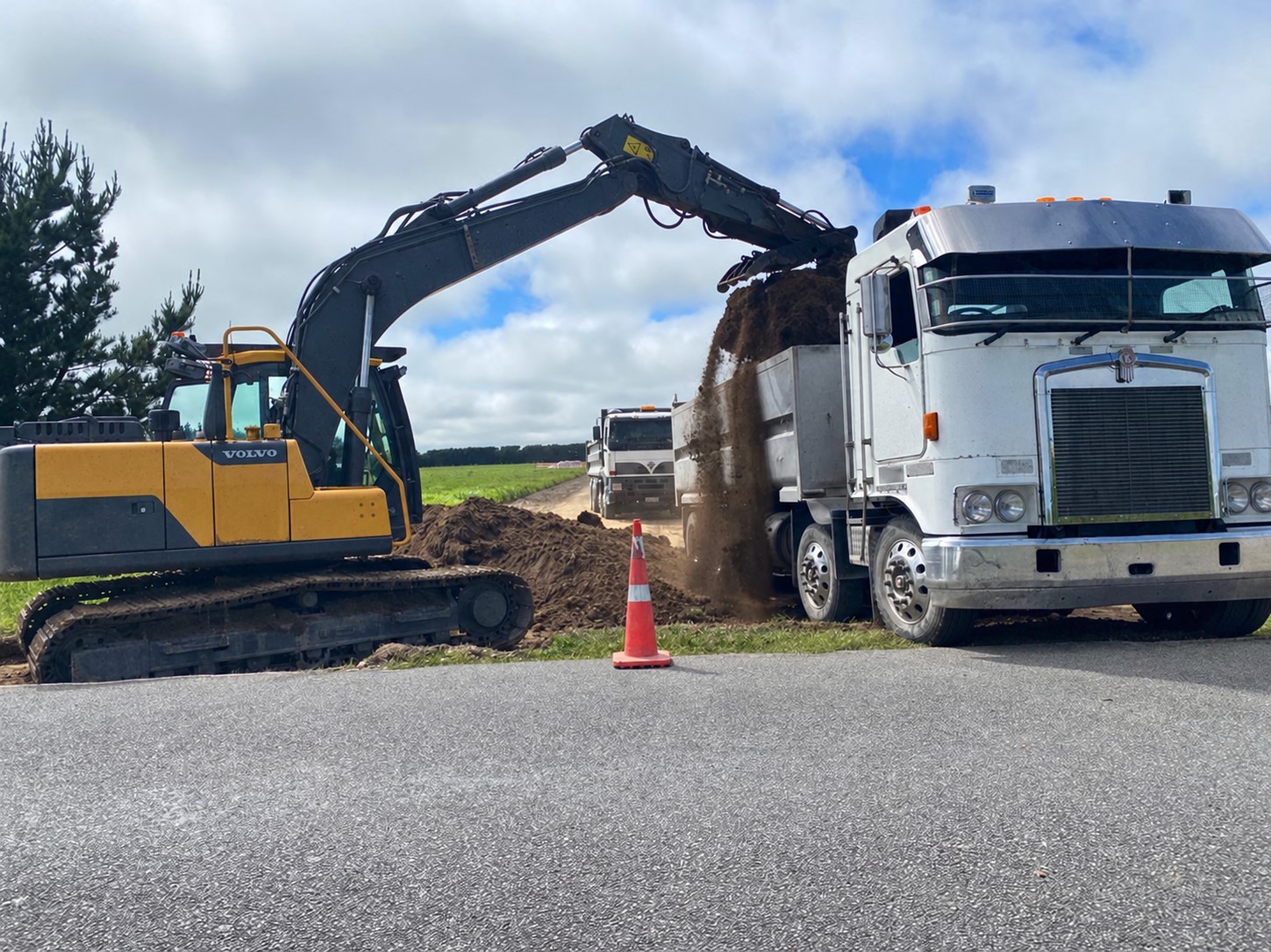 Excavator and truck undertaking North Canterbury earthworks